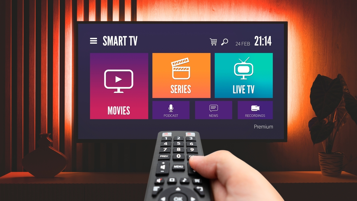 A person watching IPTV live channels on a smart TV